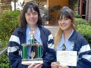 Amber Tobane and Claire Cho represented Rockhampton State High School in accepting the Music Society trophy for secondary students chamber group. Picture: Jann Houley