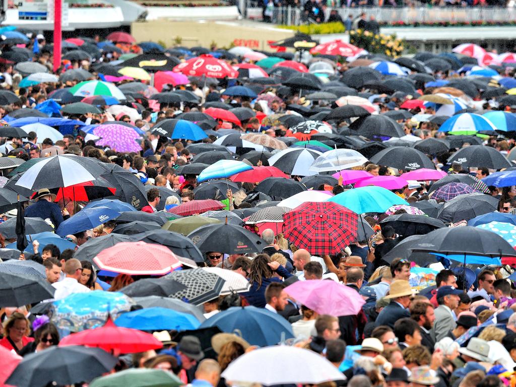 Another brief shower before the gates open. Picture: Tim Carrafa