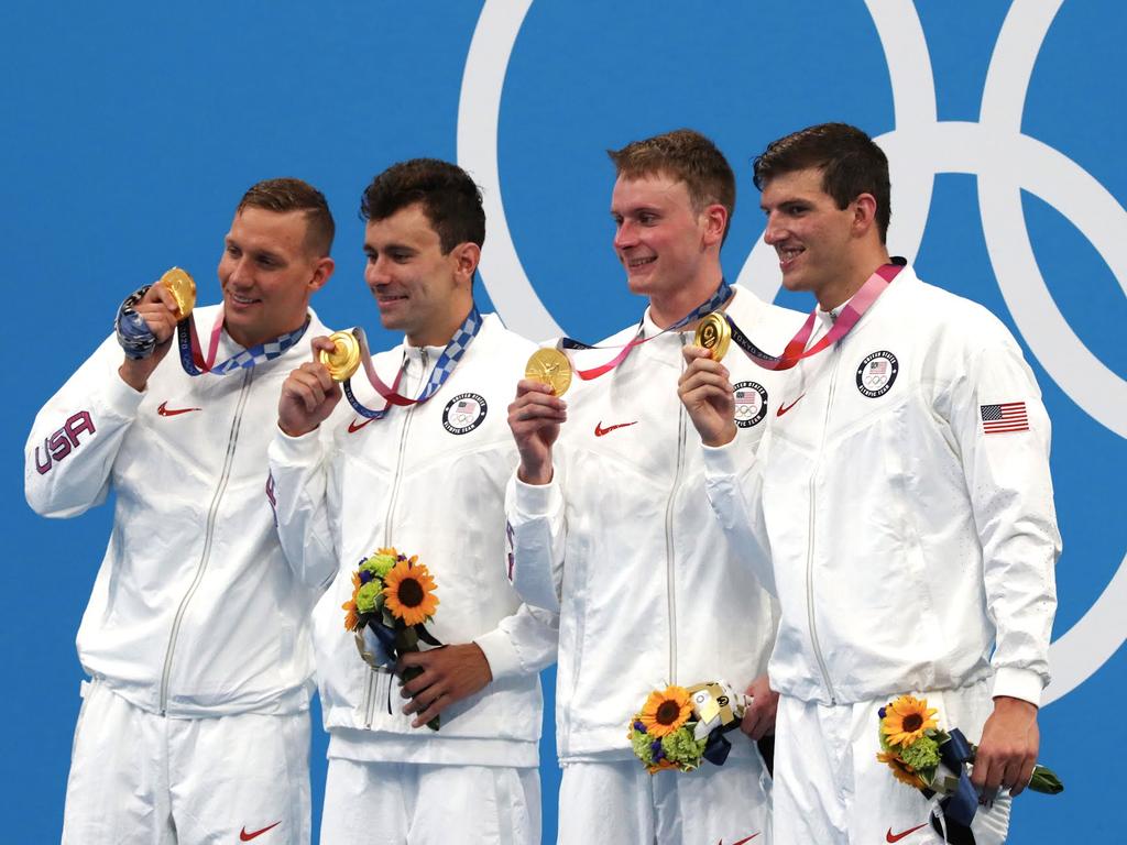 Caeleb Dressel’s banana is wrapped around his hand as he poses for photos with his gold medal. Picture: Getty Images