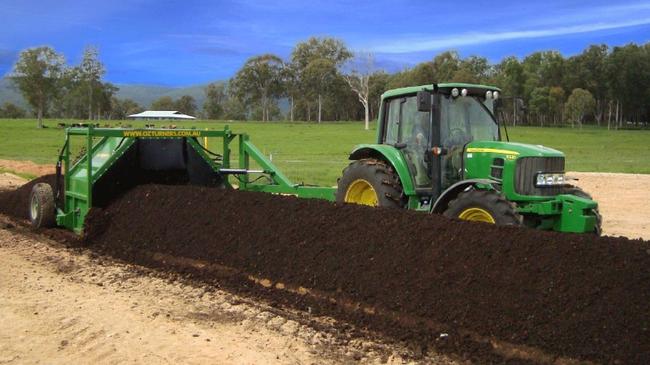 Somersby Composting Facility: A tractor driving a compost turner.