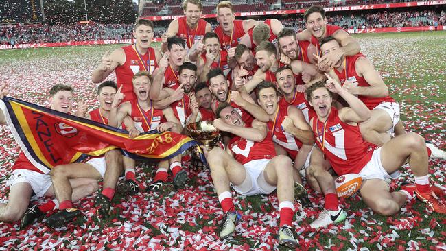 North Adelaide players celebrate their 2018 premiership. Picture: Sarah Reed