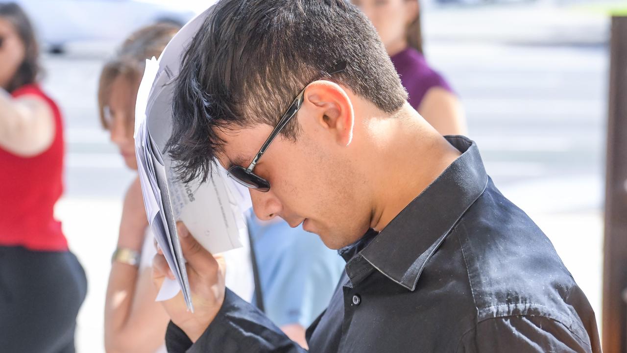 Jonty Akari, 19, is seen leaving Adelaide Magistrates Court, where he has been charged with being unlawfully on premises.