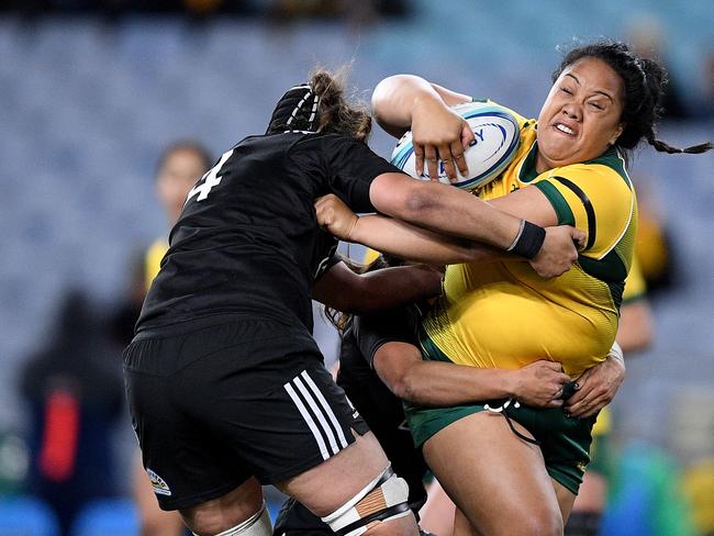 *RE-TRANSMISSION, CAPTION CORRECTION* FOR IMAGES WITH THE ID: 20180818001357817788 AND 20180818001357817768 - CORRECTING PLAYERS NAME TO LEILANI PERESE (NOT: MELISSA FATU)* THE REVISED CAPTION BELOW.  Leilani Perese of the Wallaroos is tackled by Eloise Blackwell of the Black Ferns during the Women's International rugby match between Australia and New Zealand at ANZ Stadium in Sydney, Saturday, August 18, 2018. (AAP Image/Dan Himbrechts) NO ARCHIVING, EDITORIAL USE ONLY