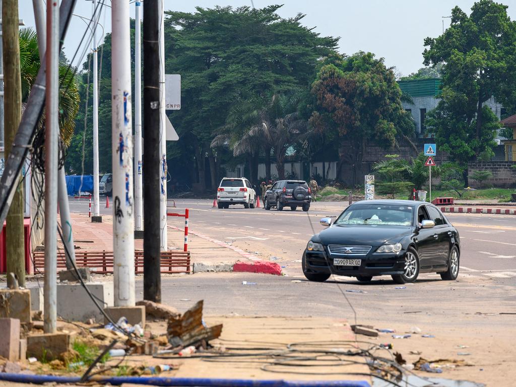 The Congolese Republican Guard diverts traffic from the scene. Picture: Arsene Mpiana/AFP