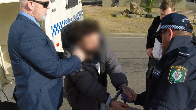 Strike Force Alcheringa detectives arrest Mohamad Raad at a Macquarie Fields fast food outlet on August 2, 2023. Picture: NSW Police.