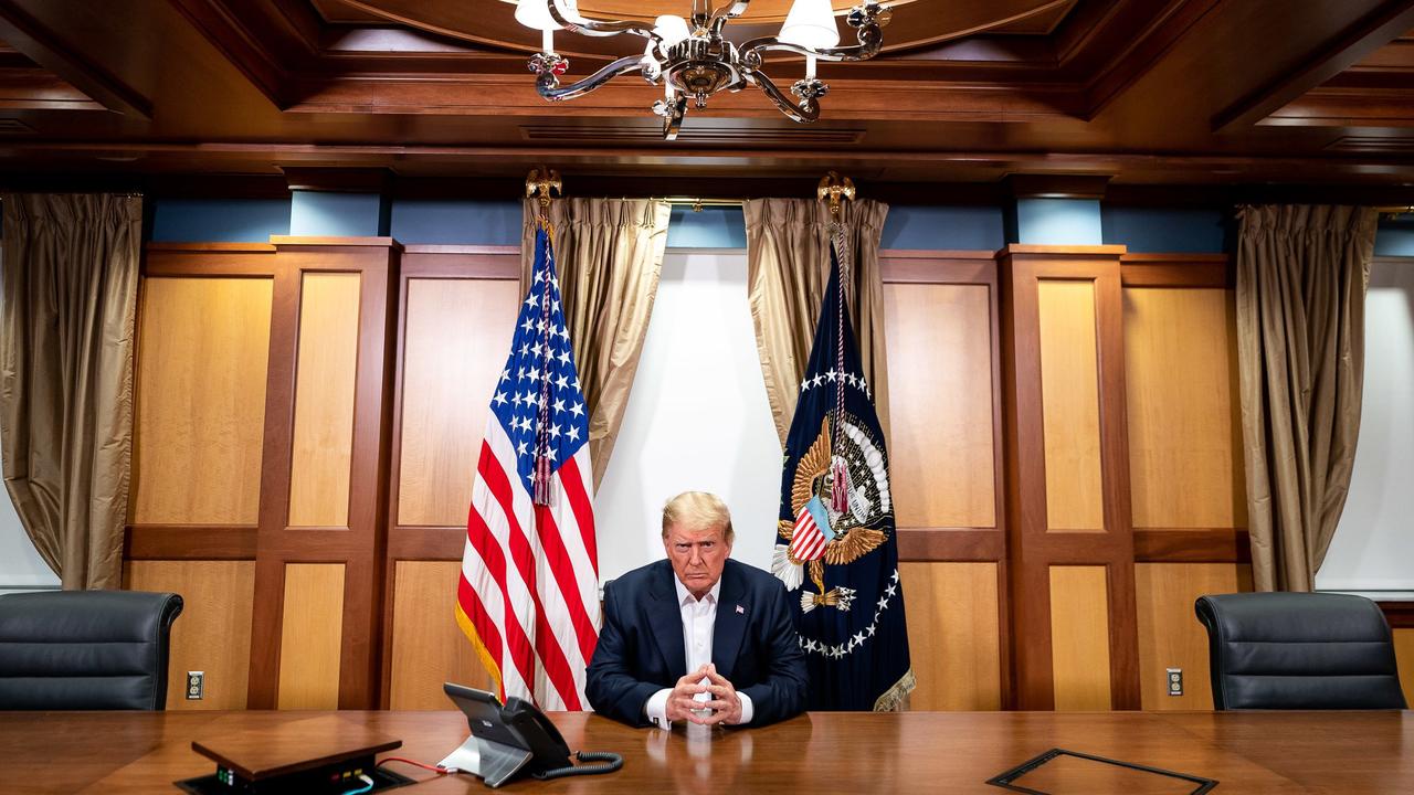 President Donald Trump participating in a phone call with the US Vice President, Secretary of State and Chairman in his conference room at Walter Reed National Military Medical Center Picture: Tia DUFOUR / The White House / AFP.