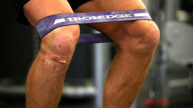 Hartlett working out in the gym as he recovers from an ACL injury last July. Picture SARAH REED