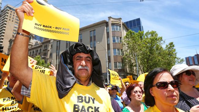 Taxi licence holders take a stand against the Victorian government at Parliament House. Picture: Mark Stewart