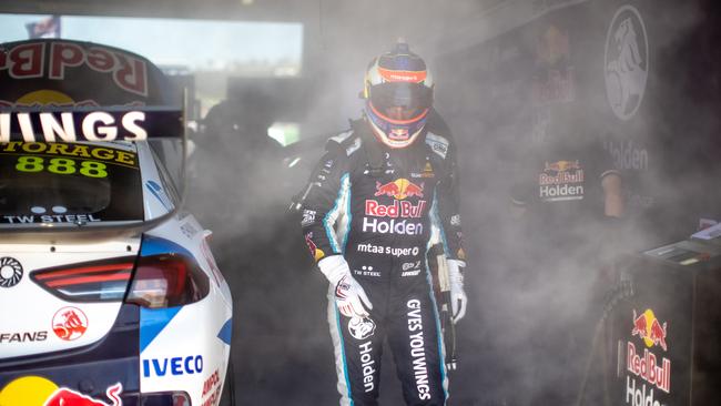 Craig Lowndes exits the pit after a small fire in practice. Picture: Mark Horsburgh/Edge Photographics/Getty Images