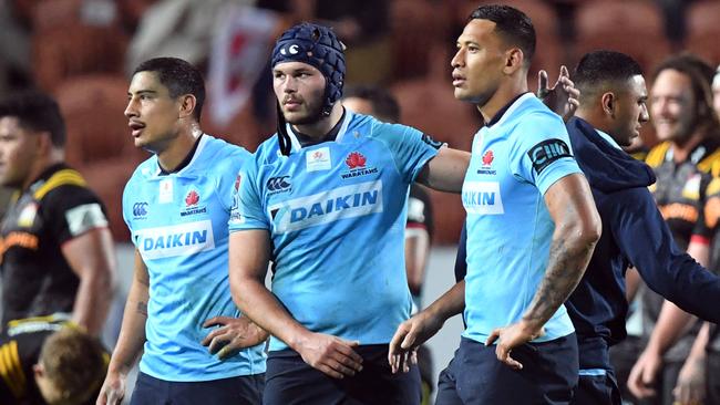 Michael Wells of the Waratahs (C) and Israel Folau after their loss to the Chiefs.