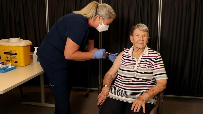 Lindsay Burrows, 90, a resident of the Rosewood Care home at Leederville, Perth, is vaccinated by nurse Gillian Longhurst on Tuesday. Picture: Colin Murty