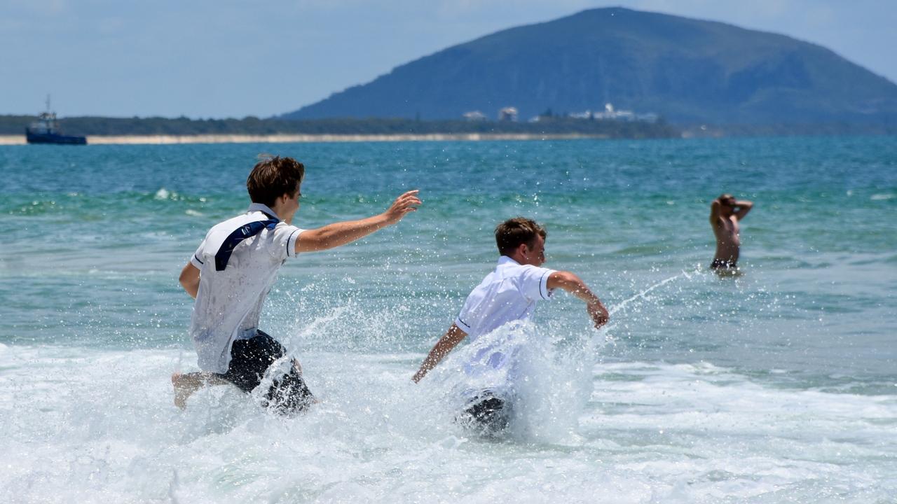 Year 12 graduates from schools across the Sunshine Coast hit to the water at Mooloolaba Beach to celebrate the end of their schooling. Photo: Mark Furler