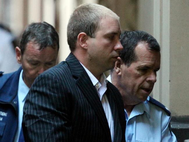 David Patrick Clifford being led into Supreme Court in Victoria.