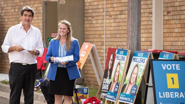 Former Parramatta state Liberal MP Geoff Lee with Katie Mullens during prepoll at Ermington Community Centre. Picture: Julian Andrews