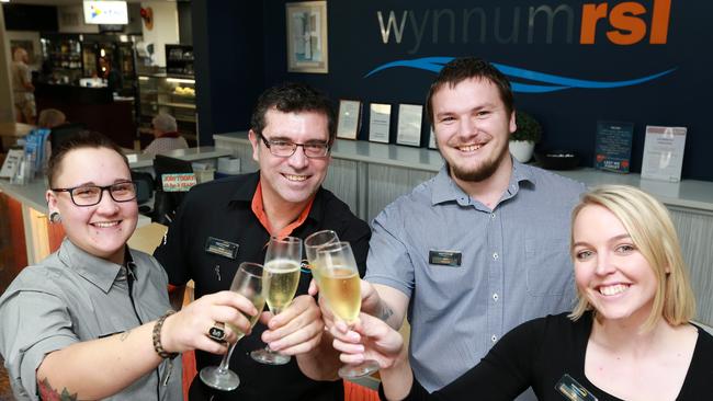 Staff from the Wynnum RSL – Breanna Sumner, Dean Hall, Joshua Stebbing and Alex Bishop celebrate as Wynnum RSL reopens its doors after COVID. Picture: Sarah Marshall