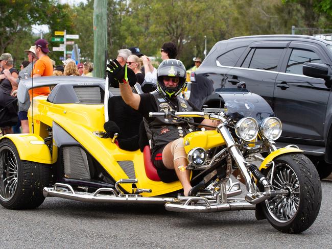 A member of the parade waves at the crowd at the 2023 Gayndah Orange Festival.