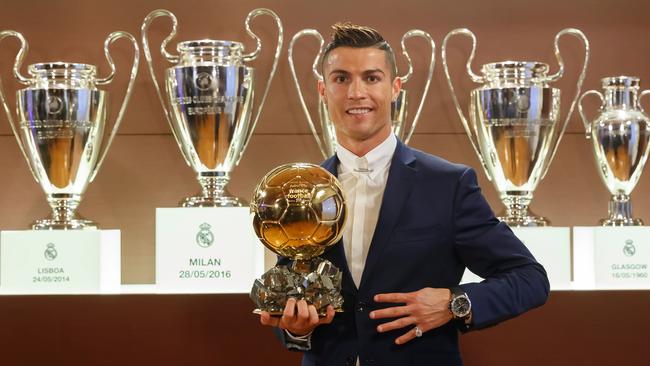 Cristiano Ronaldo posing with the Ballon d'Or.