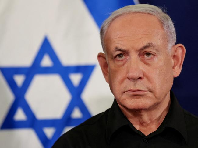 Israeli Prime Minister Benjamin Netanyahu holds a press conference with Defense Minister Yoav Gallant and Cabinet Minister Benny Gantz (not pictured) in the Kirya military base in Tel Aviv , Israel , 28 October  2023.    ABIR SULTAN POOL/Pool via REUTERS