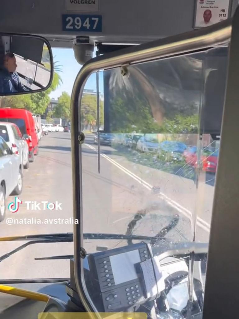 A cyclist has smashed the front window of a bus in a rage attack . Picture: TikTok