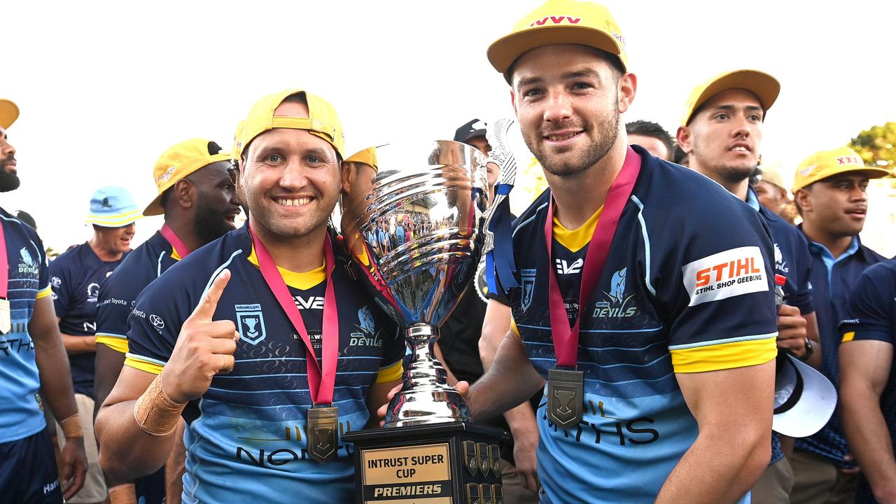 Tyrone Roberts (L) celebrates with the Intrust Super Cup trophy. Picture: Bradley Kanaris/Getty