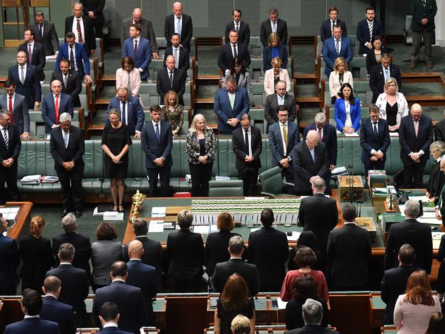 Members mark a minute of silence at Parliament House after Prime Minister Scott Morrison spoke about domestic violence. Picture: Mick Tsikas