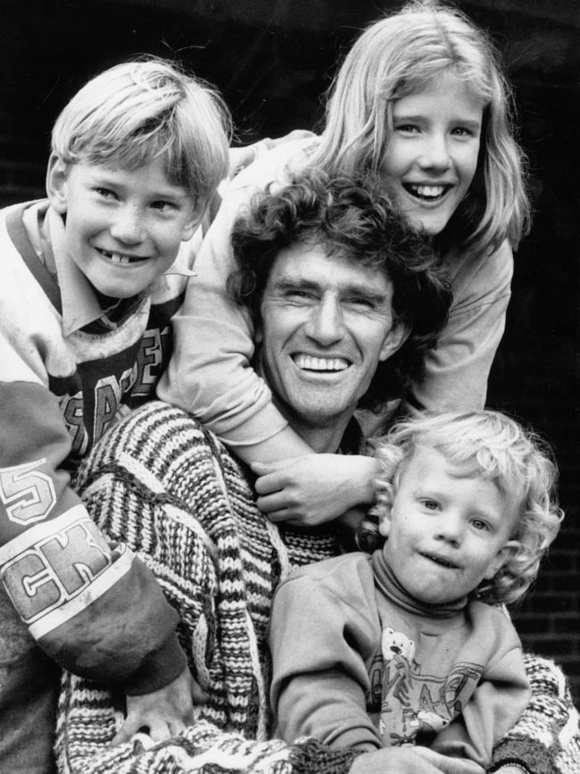 Hawthorn legend Michael Tuck in 1990 with his children Shane, Renee and Travis.