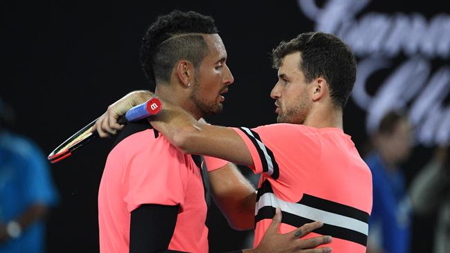 Bulgaria's Grigor Dimitrov (R) speaks with Australia's Nick Kyrgios after winning their men's singles fourth round match on day seven of the Australian Open tennis tournament in Melbourne on January 21, 2018. / AFP PHOTO / SAEED KHAN / -- IMAGE RESTRICTED TO EDITORIAL USE - STRICTLY NO COMMERCIAL USE --