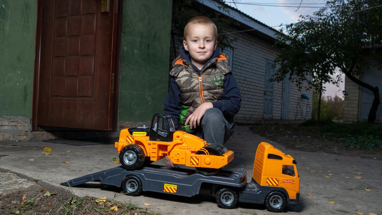 Andriy and his orange truck. Picture: Oleksii Filippov/ UNICEF