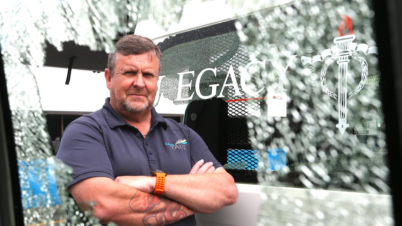 Cairns Taxis chief executive Bob Epps stands in front of a vehicle that was the target of a suspected shooting incident on Sheridan St last month in an escalation of usual rock throwing attacks on cabs. Picture: Peter Carruthers