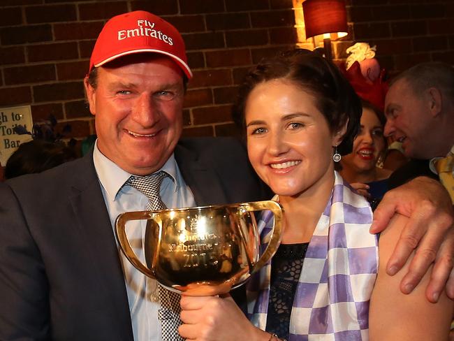 Winners are grinners... Michelle Payne and trainer Darren Weir celebrate last night.