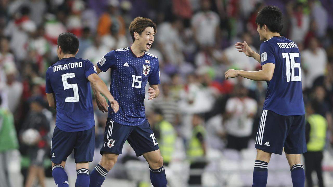 Japan players celebrate. (AP Photo/Kamran Jebreili)