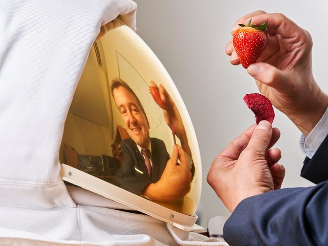 Professor Volker Hessel with two strawberries, one freeze dried at the University of Adelaide, where their team is working on improving the taste of Astronaut food, Friday, March 20, 2020. Picture: MATT LOXTON