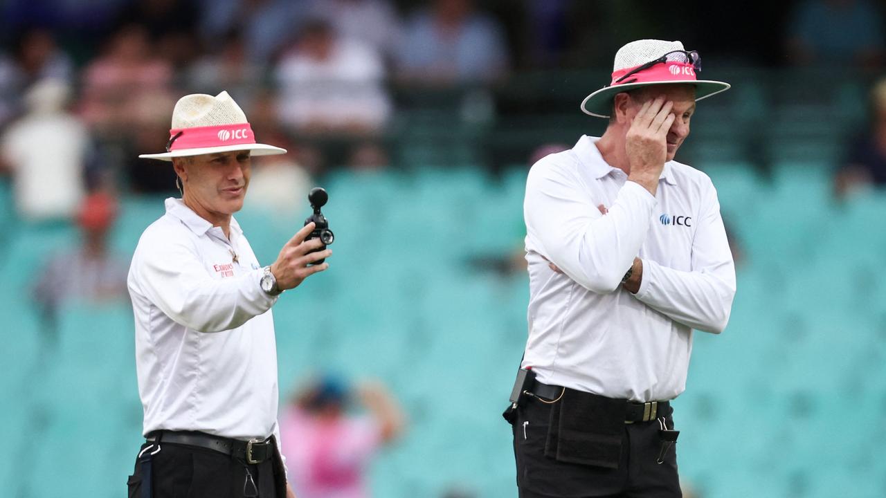 Delays for bad light infuriates fans. (Photo by DAVID GRAY / AFP)