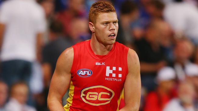 Gold Coast Suns tall forward Peter Wright has re-signed until the end of 2019.