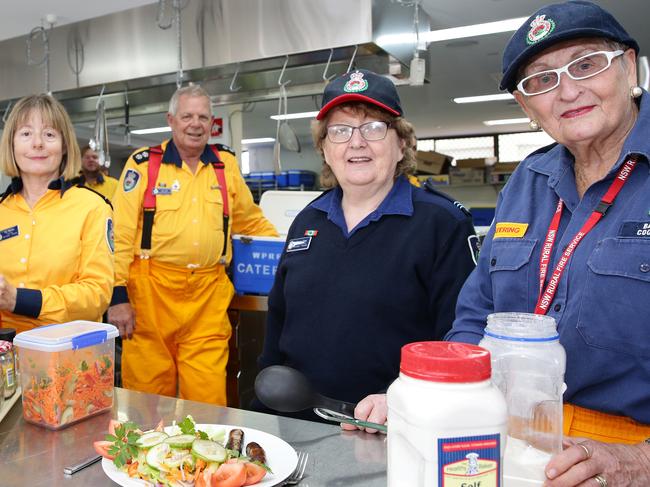 Jeff Cree, second from left with Pip Barnes, Dianne Cree and Barb Cooper in the kitchen at NSW Rural Fire Service headquarters which can dish out 2000 freshly-prepared meals a day. Picture: News Corp