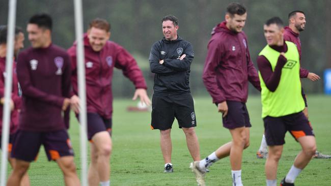 Brisbane Roar coach Robbie Fowler, centre, watches his players training earlier this week. Picture: AAP
