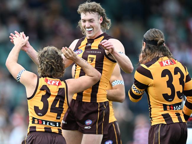 LAUNCESTON, AUSTRALIA - MAY 11: Josh Weddle and Nick Watson of the Hawks celebrate a goal of the Hawks during the round nine AFL match between match between Hawthorn Hawks and St Kilda Saints at  University of Tasmania Stadium, on May 11, 2024, in Launceston, Australia. (Photo by Steve Bell/Getty Images)