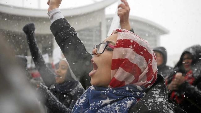 Khulud Fidama, 26, of Dearborn, Michigan, stands with her family outside the McNamara Terminal at Detroit Metropolitan Airport to speak against President Donald Trump's travel ban on refugees and citizens of seven Muslim-majority nations. Picture: Elaine Cromie