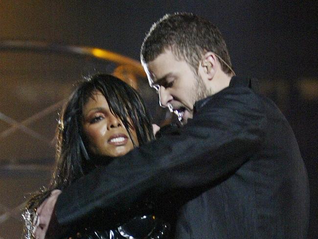 Singer Janet Jackson with singer Justin Timberlake removing breast plate from Janet's clothing during half time performance at Super Bowl XXXVIII in Houston, Texas 01 Feb 2004.