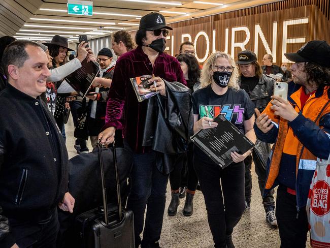 Gene Simmons is flanked by fans upon arrival at Melbourne Airport to begin the Australian leg of the End of the Road Tour. Picture: Jake Nowakowski