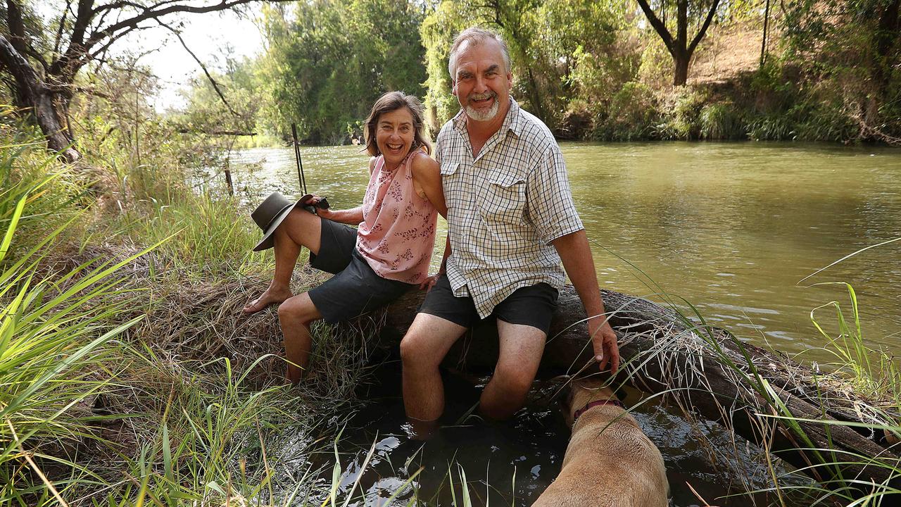 John and Gail Craigie relax on the backs of the Brisbane river, 25 metres below their house which flooded in 2011, at Pine Mountain, west of Brisbane. John organised the successful class action against the state. Picture: Lyndon Mechielsen