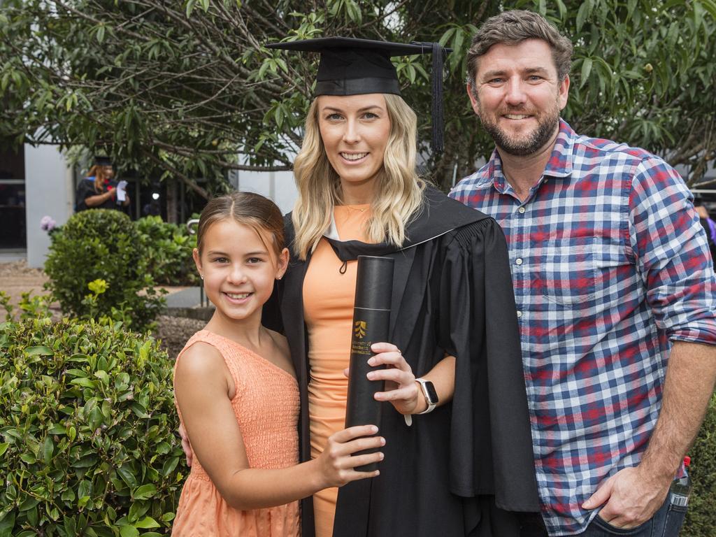 Bachelor of Business graduate Kari Smith with daughter Ahmaia Haitana and partner Aaron Cluff at a UniSQ graduation ceremony at Empire Theatres, Wednesday, February 14, 2024. Picture: Kevin Farmer