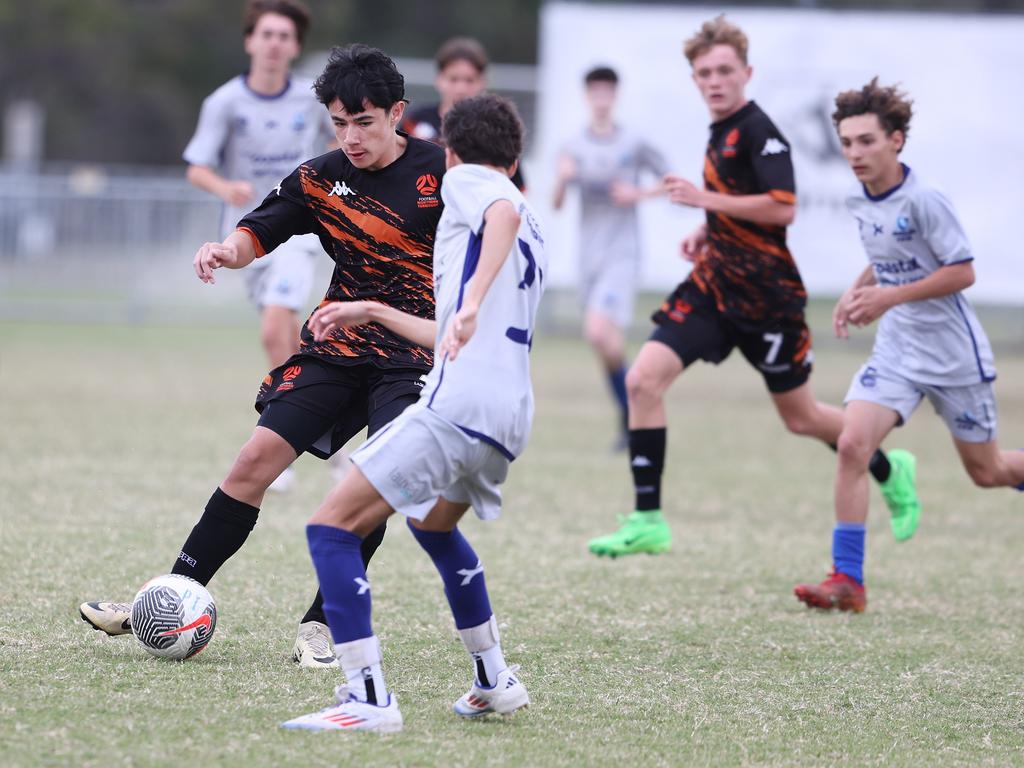 Premier Invitational Football 2024 tournament at Glennon Park Nerang. Field 2...Magic Utd (grey) V Football NT Utd. Picture Glenn Hampson