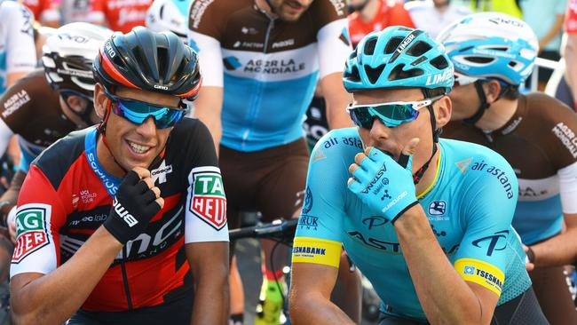 Reigning ochre jersey winner Richie Porte and Luis Sanchez Gil before the start of the Santos Tour Down Under People's Choice Classic criterium on Sunday. Picture: AFP PHOTO / BRENTON EDWARDS