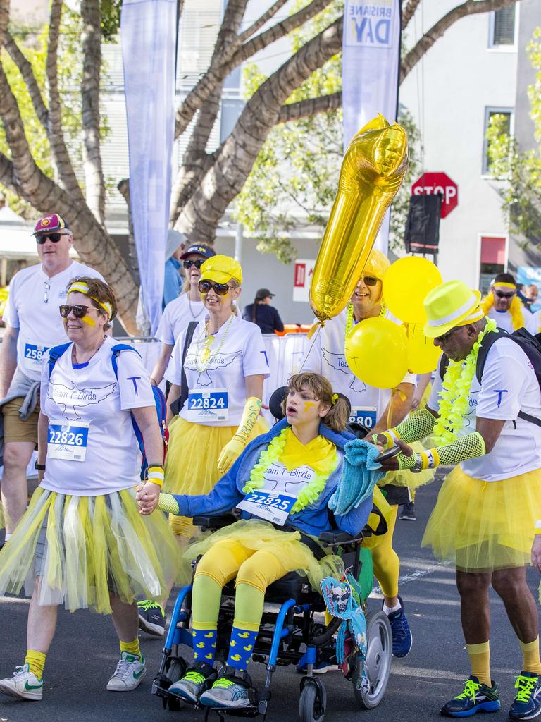 Team T-Birds at the finish line of the Bridge to Brisbane 2019 at South Bank, Sunday, August 25, 2019 (AAP Image/Richard Walker)