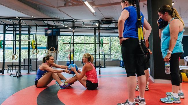 Kylie Lowbridge training one-on-one with Michelle Bridges. Photo: Jane Allen.