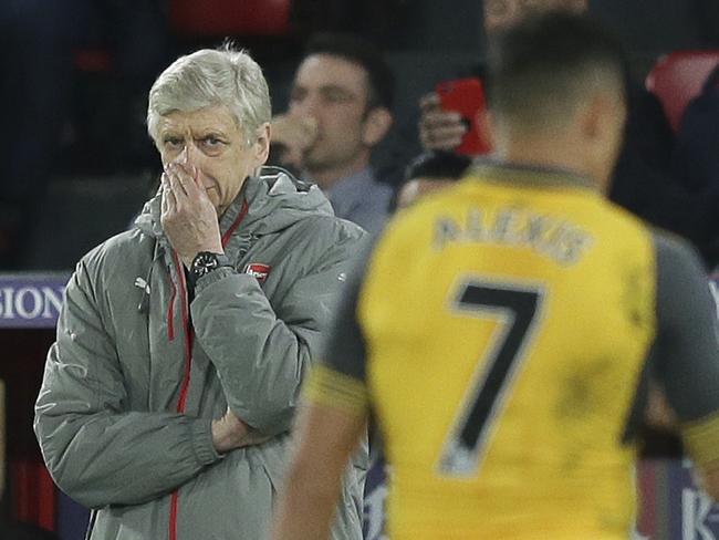 Arsenal manager Arsene Wenger looks across the pitch during the English Premier League soccer match between Crystal Palace and Arsenal at Selhurst Park in London, Monday April 10, 2017. (AP Photo/Tim Ireland)