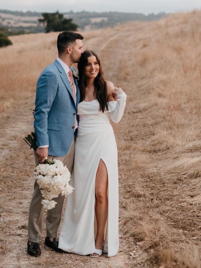 Kate and Reece share a special moment on their wedding day. Picture: Meaghan Coles