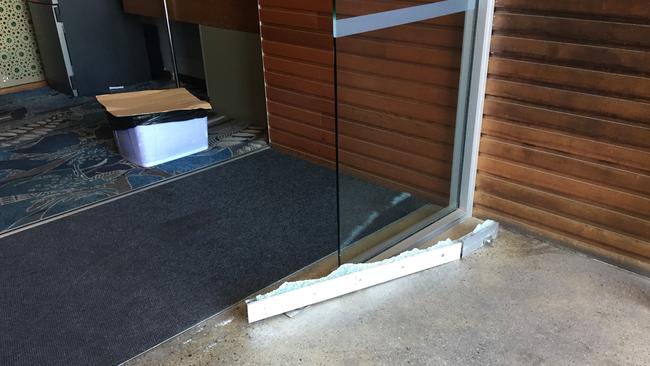 Bandits used a gun to shoot through a glass door to get inside the Norfolk Tavern at Ormeau on the Gold Coast.