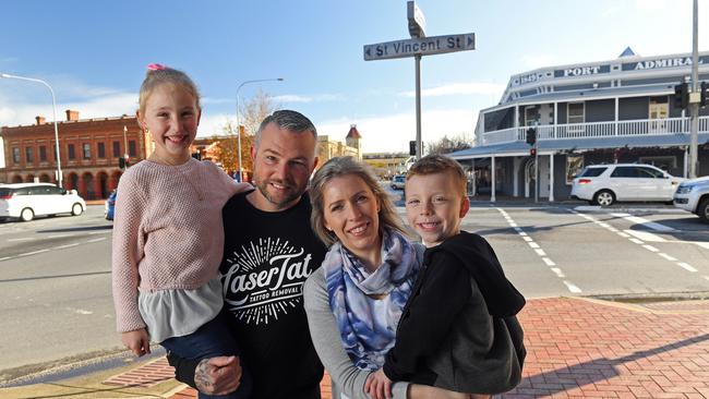 Amanda and Kelly McKinnon, the owners of Black Diamond Tattoo, with kids Charlotte, 7, and Lockie, 6. Picture: Tom Huntley